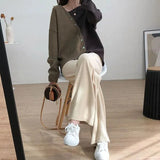 Style Female Irregular Spliced Skew Collar Sweaters Fashion All-match Contrasting Colors Button Loose Knitted