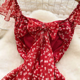 Sweet Design With A Knotted Bow Tie With Bare Back To The Waist Of A Floral